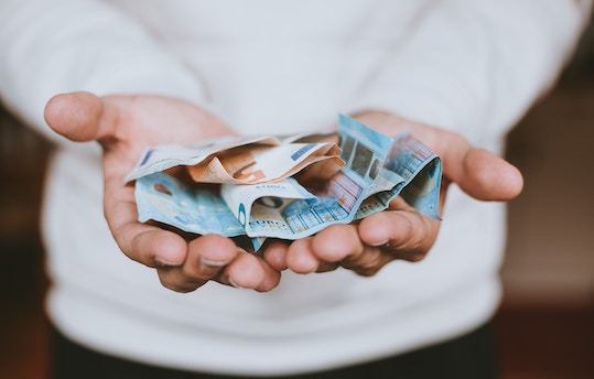 hand full of euros in ireland