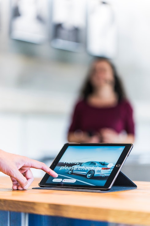 person logging in on tablet