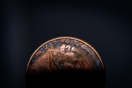 United States penny on black background